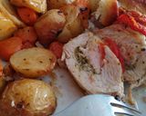 A picture of step 3 of Hasselback chicken with pesto, mozzarella and tomatoes.