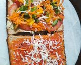 A picture of step 3 of Grilled sandwich filled with hummus, red sauce and vegetables.