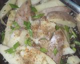 A picture of step 6 of Garlic buttery potato wedges.