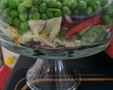 A picture of step 3 of 7 layer Salad.