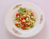 A picture of step 5 of Ajwain leaf salad with veggies and pineapple.