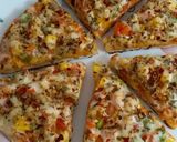 A picture of step 11 of Cheesy Mexican Veg Pizza.
