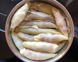 A picture of step 4 of Malfouf Mehcheh - stuffed cabbage rolls.