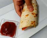 A picture of step 9 of Tortilla Egg Roll.