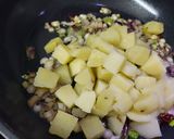 A picture of step 3 of Potatoes with Green Onion.
