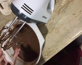 A picture of step 4 of Black forest chocolate sponge cake.