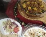 A picture of step 6 of Aalu qeema with dahi phulki.