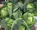 A picture of step 1 of Caramelised Savoy cabbage with tomato and beans.