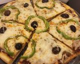 صورة لخطوة 14 من وصفة بيتزا 🍕 ولااااااطيب
