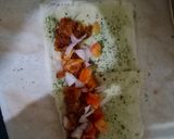 A picture of step 17 of Tandoori chicken rolls up.