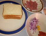 A picture of step 2 of Cheesy sausage sandwich.