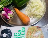 A picture of step 1 of Veg Hakka noodles with spring onions.