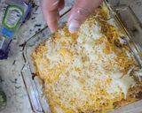 A picture of step 10 of Bourbon barbecue chicken lasagna roll ups.
