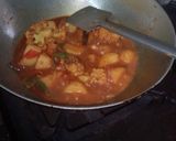 A picture of step 24 of Aloo fulcopi katla rosha ar misti doi.