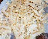 A picture of step 2 of Cassava Crisps infused with Garlic.