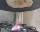 A picture of step 5 of Chicken masala with tawa garlic naan.