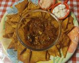 A picture of step 15 of Nachos with salsa and dips.