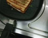 A picture of step 4 of Capsicum onion grilled cheese sandwich.