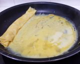 Une image de l'étape 9 de Tamagoyaki (omelette japonaise sucrée).