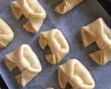 A picture of step 39 of Chessy-Chicken filled bowtie buns.