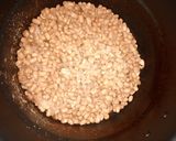 A picture of step 1 of White rice, beans with dried fish stew.