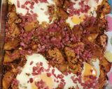 Foto del paso 8 de la receta Patatas especiadas al horno con huevo y virutas de jamón