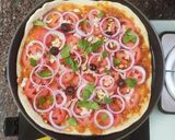 A picture of step 4 of Italian thin crust pizza.