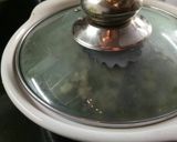A picture of step 8 of Khandeshi vangyache bharit with smoke.