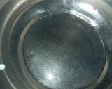 A picture of step 1 of Make curd hot in winter season by double boiling method example dahi vada.