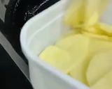 A picture of step 2 of Masala potatoes slices.