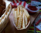 A picture of step 8 of #THE BIG FIVE#KIDS MENU Kuku Kikapu with Curly Chips.