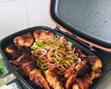A picture of step 4 of Grilled chicken thighs and breasts.