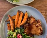 A picture of step 1 of Sticky bbq chicken thighs served with sweet potato chips and a crisp lemon salad.