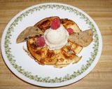 A picture of step 7 of Rice flour pancakes with frozen banana yogurt and strawberry sauce.