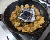 A picture of step 2 of Instant chicken Tikka Pizza in frying pan.