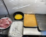 A picture of step 3 of German pork schnitzel.