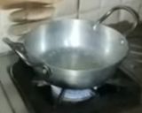 A picture of step 13 of Ashtami special prasaad the puri chana and halwa thali.
