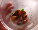 Foto del paso 9 de la receta: Cazuela de merluza con espárragos, olivas negras y picada de almendras