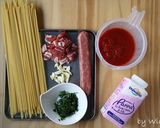 A picture of step 1 of Sausage and Bacon Tomato Sauce Pasta.