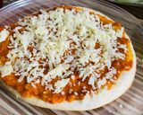 A picture of step 3 of Pizza with readymade Pizzabase.