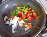 A picture of step 2 of Egg Burrito with Peppers and Chorizo Queso.