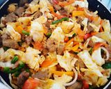 A picture of step 2 of White rice paired with beef shredded pepperoni veggies.