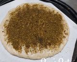 A picture of step 4 of Za'atar loaded Cheese Pizza.
