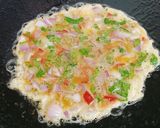 A picture of step 3 of Omelette,Bread 🍞🥚🥚🍞.