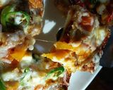 A picture of step 7 of Chicken tikka bread pizza 😋👍.
