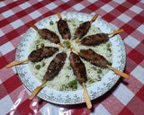 A picture of step 7 of Kefta Skewers on a Bed of Steamed Rice with Green Peas.