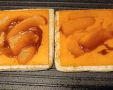 A picture of step 2 of Cheddar and brown sauce toastie.