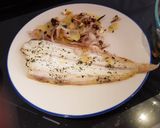 A picture of step 7 of Dover Sole in the oven with hot and crispy onion and potato on the side.