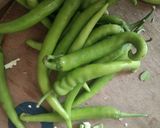 A picture of step 1 of Green chilli pickles.