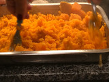 Ñoquis de batata rellenos con muzzarella y salsa bolognesa